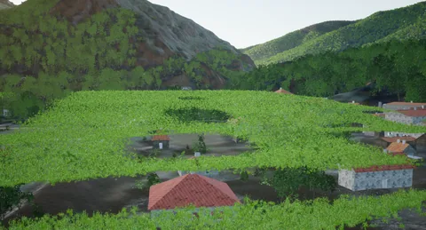 Hameau et prairies sous la barre rocheuse