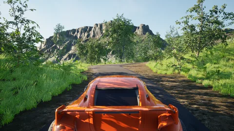 En voiture sur la piste, sous les dents rocheuses